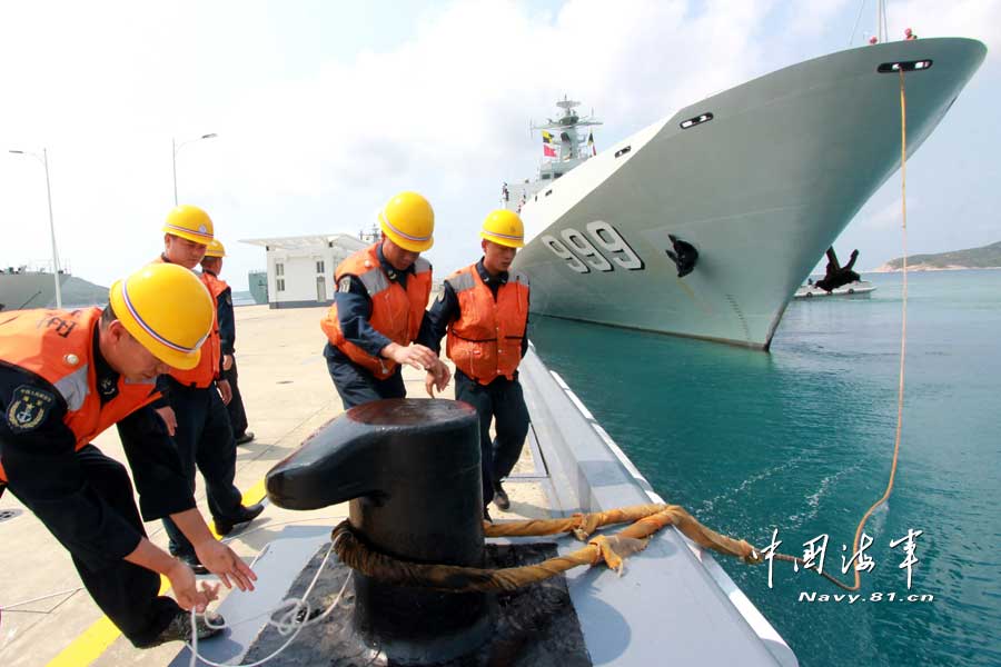 The joint mobile ship formation of the South China Sea Fleet under the Navy of the Chinese People's Liberation Army (PLA) officially returned to its home port at 09:00 on April 3, 2013. During the 16-day-long voyage, the joint mobile ship formation successively completed drills on 30-odd subjects such as defensive combat in naval mooring area, three-dimensional landing of the marine element, combined-arms assault on "enemy's" maritime mobile ship formation by various types of aircraft, maritime anti-terrorism and maritime search and rescue. The joint mobile ship formation sailed through the waters of the Xisha Islands, the Nansha Islands, the Zengmu Reef, the Bashi Channel and Western Pacific Ocean with a total navigation range of nearly 5,000 nautical miles. (China Military Online/Li Zhanglong)