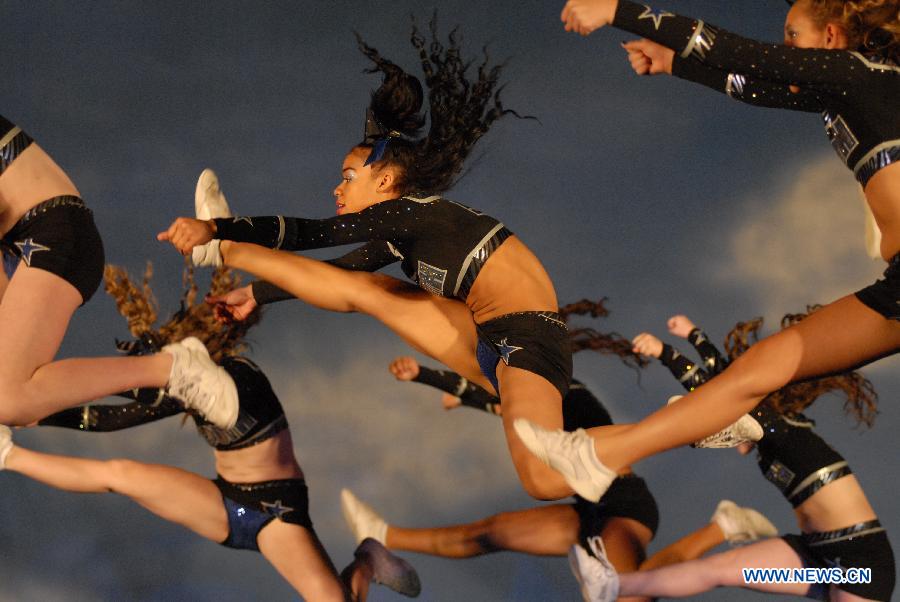 Cheerleaders compete during the 2013 Sea to Sky International Cheerleading Championship in Vancouver, Canada, on April 7, 2013. More than 3,500 athletes from 135 cheerleading teams competed for a chance to perform at the 2013 World Cheerleading Championship in Orlando, Florida, at the end of April 2013. (Xinhua/Sergei Bachlakov) 