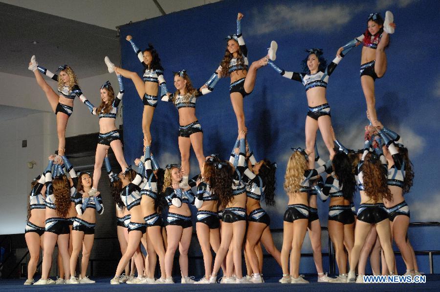 Cheerleaders compete during the 2013 Sea to Sky International Cheerleading Championship in Vancouver, Canada, on April 7, 2013. More than 3,500 athletes from 135 cheerleading teams competed for a chance to perform at the 2013 World Cheerleading Championship in Orlando, Florida, at the end of April 2013. (Xinhua/Sergei Bachlakov) 