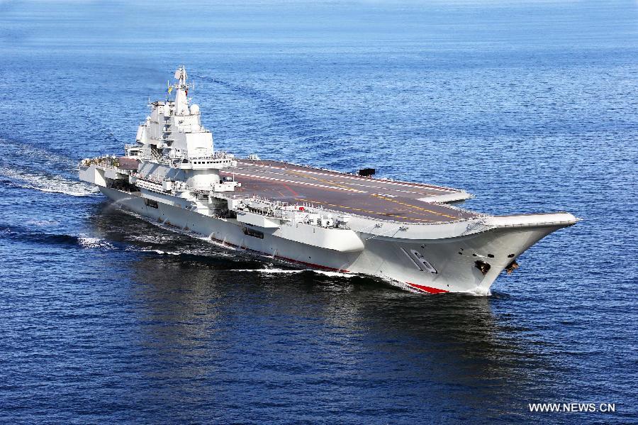 This undated photo shows China's first aircraft carrier, the Liaoning, sailing on the sea. (Xinhua/Zha Chunming)