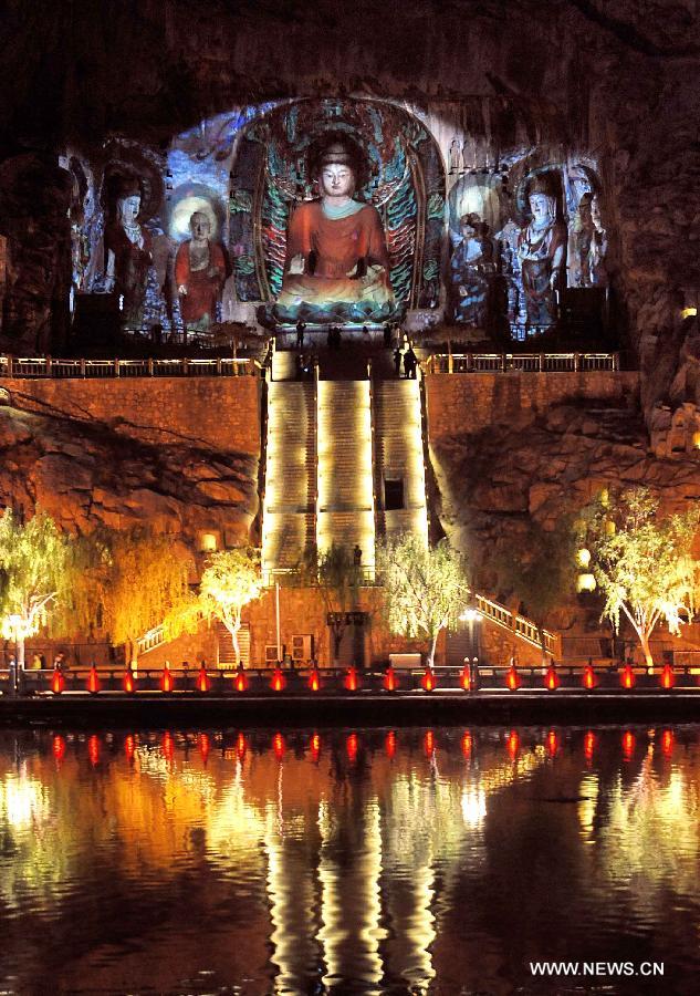 Photo taken on April 8, 2013 shows the night scenery of Fengxian Temple in scenic area of Longmen Grottoes in Luoyang, central China's Henan Province. The night tour at Longmen Grottoes, a world cultural heritage site, has been opened to public since Monday. (Xinhua/Wang Song)