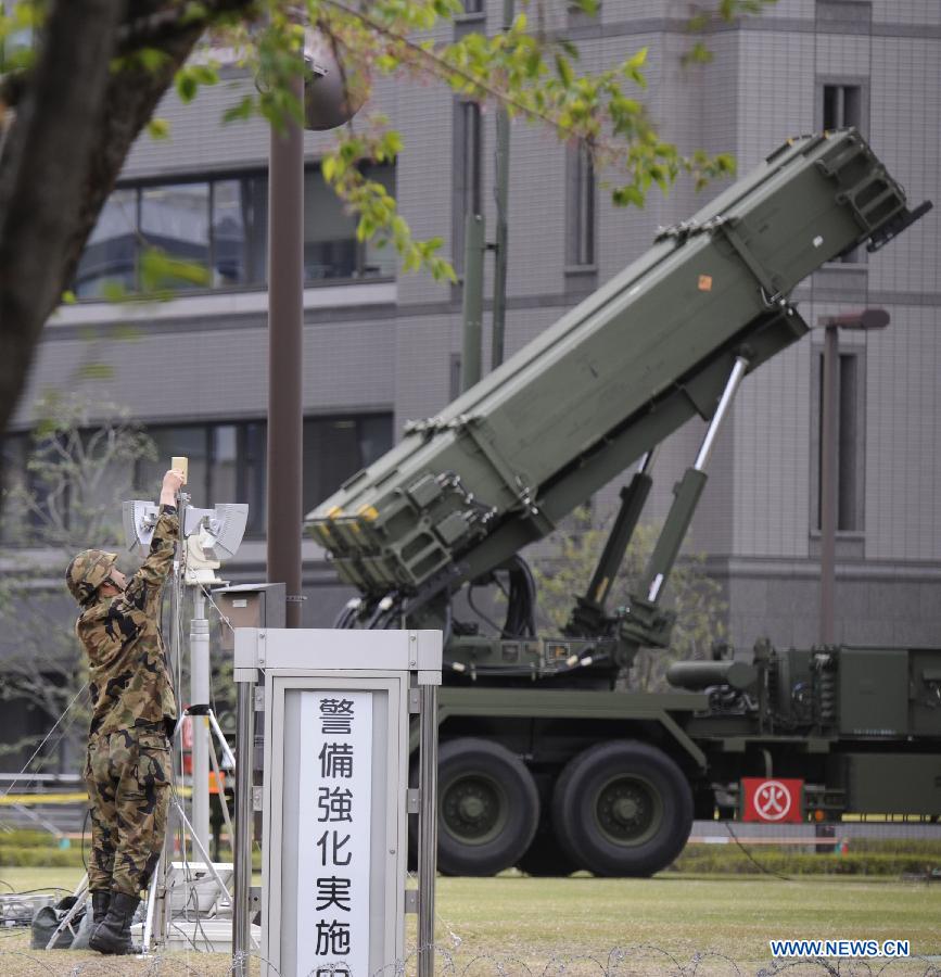 A Japan Self-Defense Forces soldier stands guard near PAC-3 missiles at the Defense Ministry in Tokyo, capital of Japan, April 9, 2013. Japan's Defense Ministry deployed Tuesday Patriot Advanced Capability-3 (PAC-3) missile interceptor in central Tokyo, in a move to prepare for the possible missile launch of the Democratic People's Republic of Korea. (Xinhua/Kenichiro Seki) 