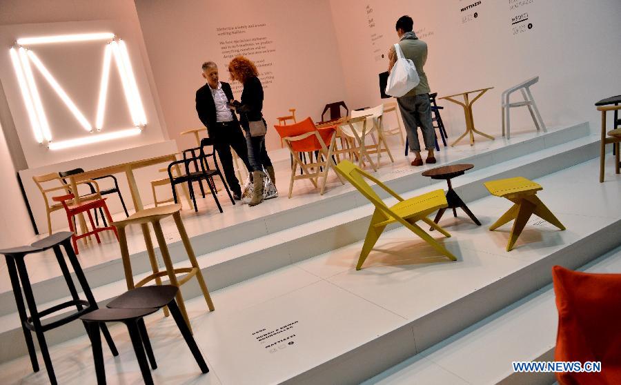 People visit at the Milan International Furniture Fair in Milan, Italy, on April 9, 2013. The 52nd edition of Milan's annual furniture fair is taking place from April 9 to 14. (Xinhua/Xu Nizhi) 