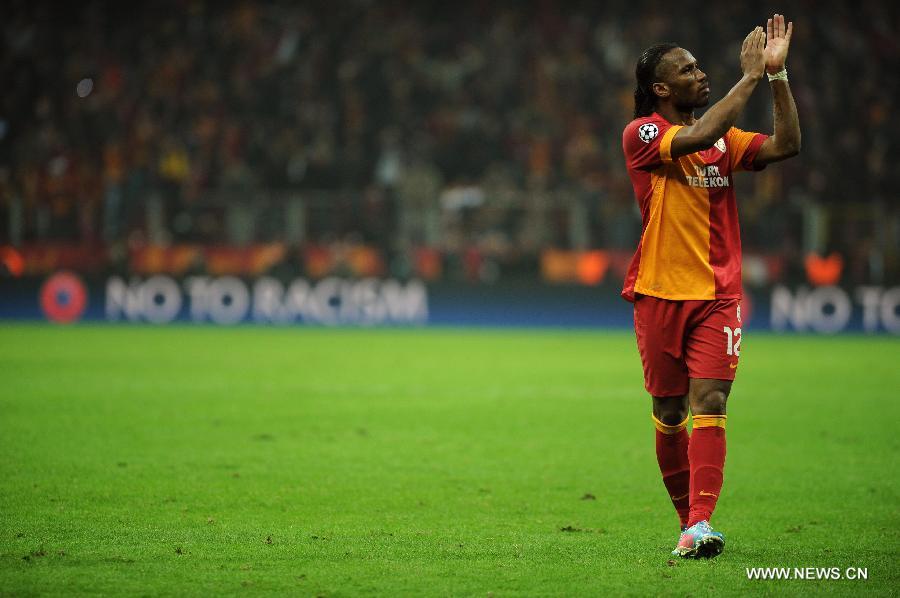 Galatasaray's Didier Drogba gestures to the audience during the UEFA Champions League quarter final second leg soccer match between Galatasaray and Real Madrid in Istanbul, Turkey, April 9, 2013. Real Madrid lost 2-3 but entered the semifinal with a total result 5-3.(Xinhua/Ma Yan)