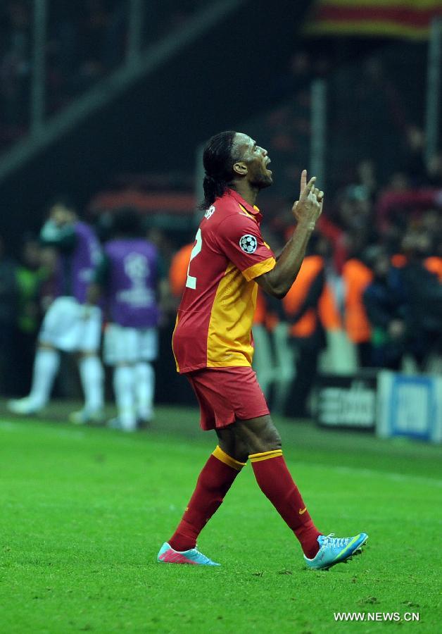 Galatasaray's Didier Drogba celebrates after scoring a goal during the UEFA Champions League quarter final second leg soccer match between Galatasaray and Real Madrid in Istanbul, Turkey, April 9, 2013. Real Madrid lost 2-3 but entered the semifinal with a total result 5-3.(Xinhua/Ma Yan)