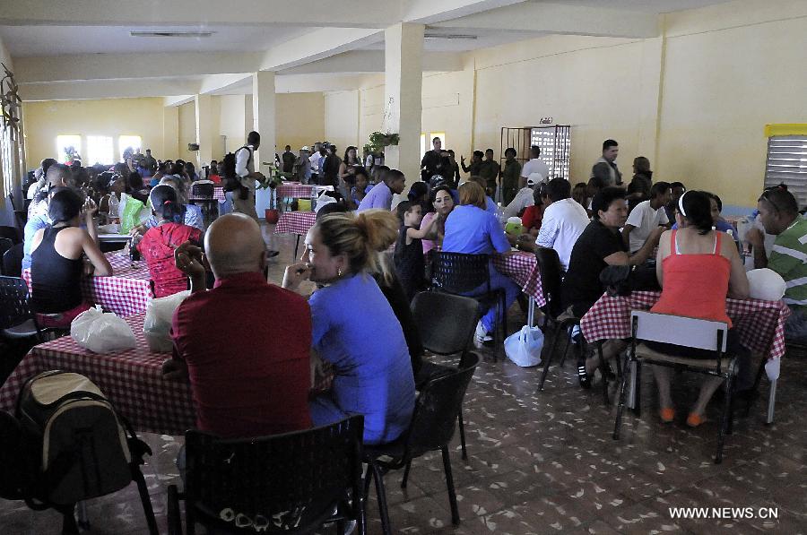 Inmate women receive the visit of their relatives at the Women's Prison in el Guatao village, of La Lisa municipalty, in Havana, Cuba, on April 9, 2013. Local and foreign media representatives made a tour in the Women's Prison and Re-education Center for San Francisco de Paula Youth. (Xinhua/Joaquin Hernandez) 