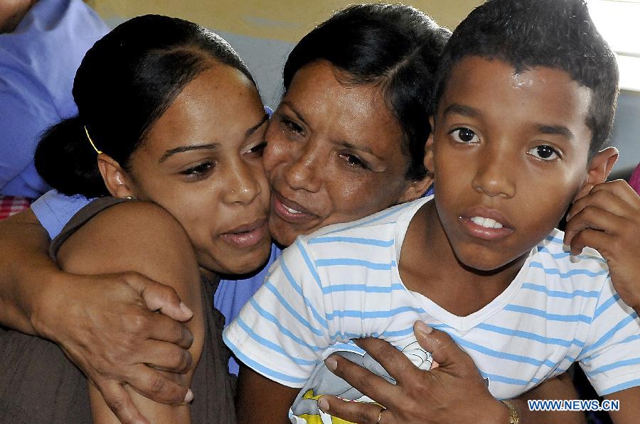 An inmate woman receives the visit of her children at the Women's Prison in el Guatao village, of La Lisa municipalty, in Havana, Cuba, on April 9, 2013. Local and foreign media representatives made a tour in the Women's Prison and Re-education Center for San Francisco de Paula Youth. (Xinhua/Joaquin Hernandez)  