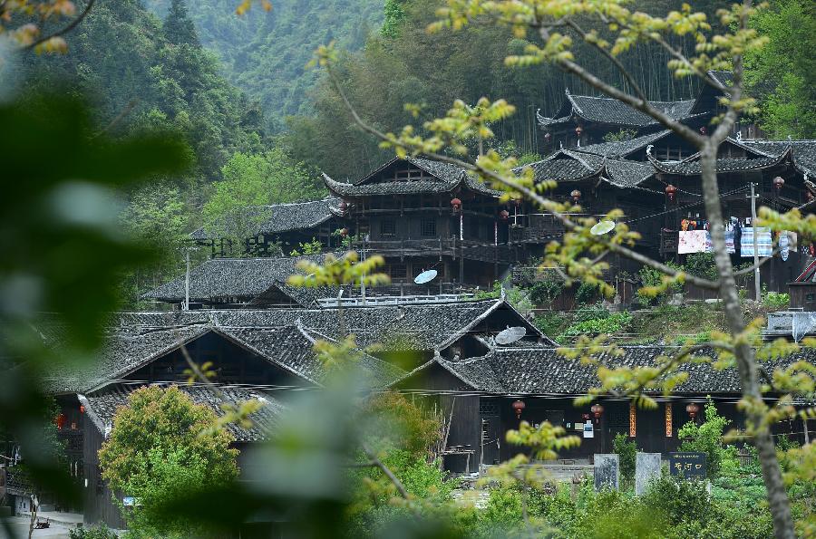 Photo taken on April 10, 2013 shows stilted buildings in Lianghekou Village in Enshi, central China's Hubei Province. Stilted buildings of Tujia ethnic group, mainly seen in central China's Hunan and Hubei Province, is a gem of Chinese residence. Lianghekou Village is one of the best reserved areas for Tujia stilted buildings. (Xinhua/Song Wen) 