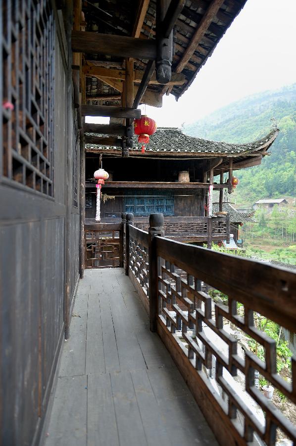 Photo taken on April 10, 2013 shows stilted buildings in Lianghekou Village in Enshi, central China's Hubei Province. Stilted buildings of Tujia ethnic group, mainly seen in central China's Hunan and Hubei Province, is a gem of Chinese residence. Lianghekou Village is one of the best reserved areas for Tujia stilted buildings. (Xinhua/Song Wen) 