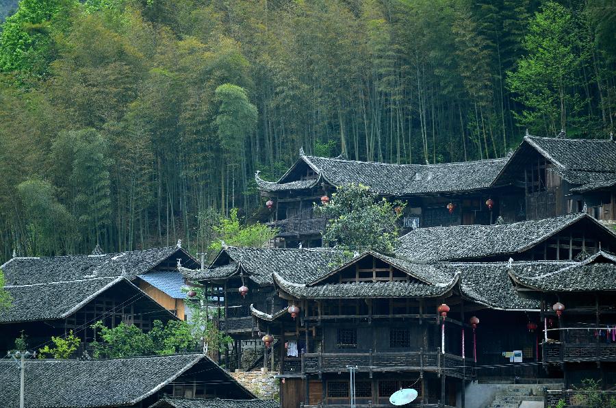 Photo taken on April 10, 2013 shows stilted buildings in Lianghekou Village in Enshi, central China's Hubei Province. Stilted buildings of Tujia ethnic group, mainly seen in central China's Hunan and Hubei Province, is a gem of Chinese residence. Lianghekou Village is one of the best reserved areas for Tujia stilted buildings. (Xinhua/Song Wen) 