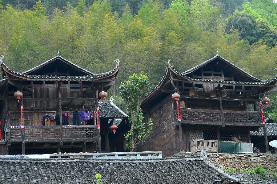 Photo taken on April 10, 2013 shows stilted buildings in Lianghekou Village in Enshi, central China's Hubei Province. Stilted buildings of Tujia ethnic group, mainly seen in central China's Hunan and Hubei Province, is a gem of Chinese residence. Lianghekou Village is one of the best reserved areas for Tujia stilted buildings. (Xinhua/Song Wen) 