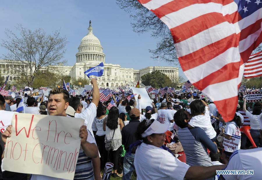 Immigration reform supporters demonstrate in the "Rally for Citizenship" on the West Lawn of Capitol Hill in Washington D.C., capital of the United States, April 10, 2013. Two senior U.S. Senators, Democratic Senator Charles Schumer and Republican Senator John McCain, who are working together to broker an immigration reform plan on Sunday, expressed optimism that a bill could be ready within this week. (Xinhua/Zhang Jun) 