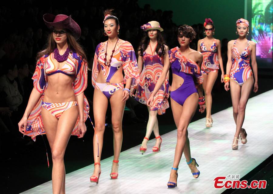 Models perform on the catwalk at the Aimer for the opening show of 2013 Shanghai Fashion Week, April 10, 2013. (CNS /Pan Suofei)