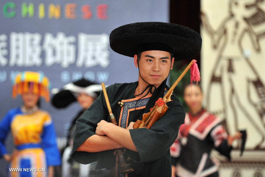 A model presents a costume of the Miao ethnic group at the Guangxi Museum of Nationalities in Nanning, capital of south China's Guangxi Zhuang Autonomous Region, April 12, 2013. A total of 210 set of traditional costumes of the Miao ethnic group went on display here on Friday. Costumes of the Miao ethnic group is well known for its fine craftsmanship, brilliant colors, various styles and rich cultural connotations. (Xinhua/Lu Boan)