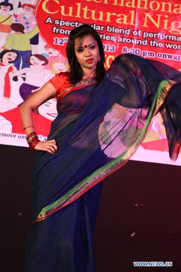 Hoi, a student from Bangladesh participates in a fashion show in Jawaharlal Nehru University (JNU) in New Delhi, capital of India, April 12, 2013. International students from 14 countries and regions held a fashion show on Friday night on campus of the JNU in New Delhi. (Xinhua/Li Yigang)