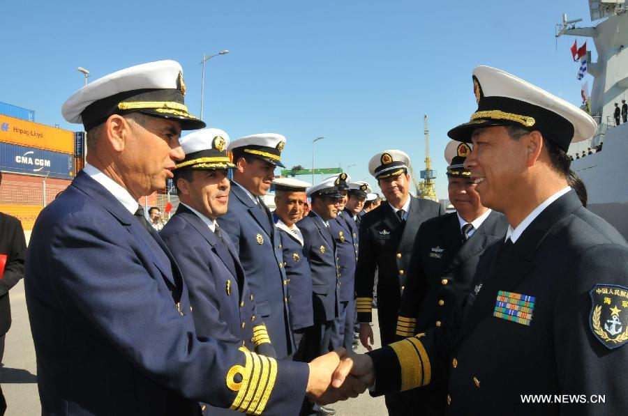 Li Xiaoyan (1st R), commander of 13th Escort Taskforce of the Chinese navy, shakes hands with Moroccan navy officers before leaving in Casablanca, Moroco, April 13, 2013. The 13th Escort Taskforce of the Chinese navy on Saturday ended a five-day visit to Morocco. (Xinhua/Lin Feng) 