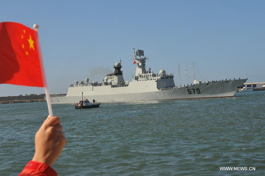 Local Chinese wave goodbye to Chinese navy soldiers in Casablanca, Moroco, April 13, 2013. The 13th Escort Taskforce of the Chinese navy on Saturday ended a five-day visit to Morocco. (Xinhua/Lin Feng)