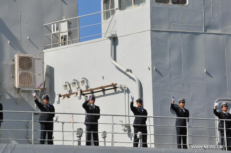 Chinese navy soldiers wave goodbye to people on the depot ship Qinghai Lake in Casablanca, Moroco, April 13, 2013. The 13th Escort Taskforce of the Chinese navy on Saturday ended a five-day visit to Morocco. (Xinhua/Lin Feng)