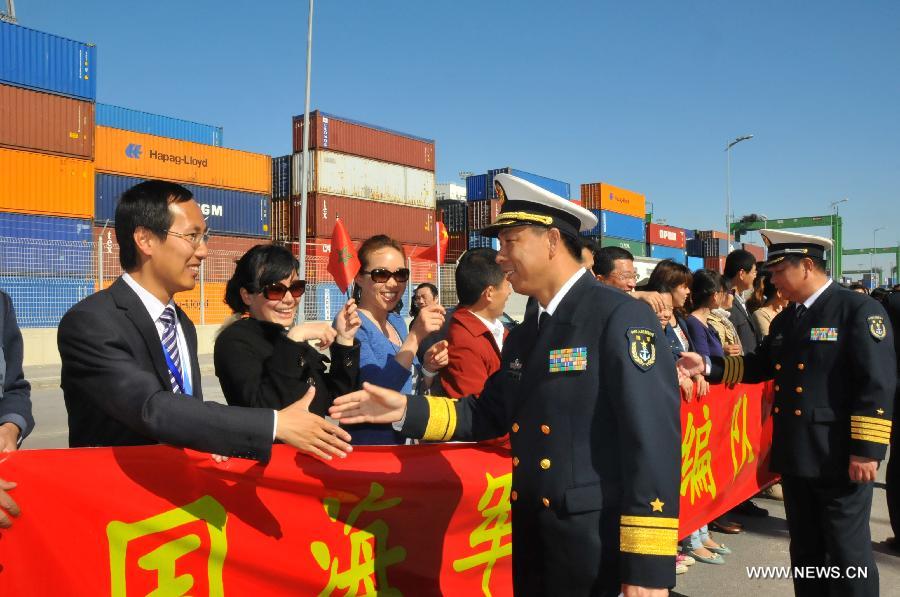 Li Xiaoyan (R, front), commander of 13th Escort Taskforce of the Chinese navy, shakes hands with local Chinese before leaving, in Casablanca, Moroco, April 13, 2013. The 13th Escort Taskforce of the Chinese navy on Saturday ended a five-day visit to Morocco. (Xinhua/Lin Feng) 