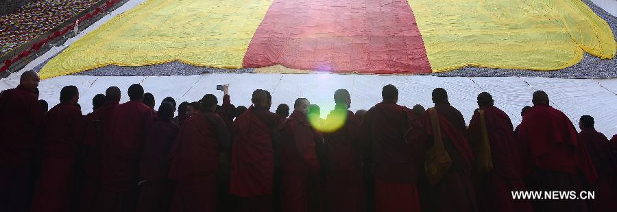 Buddhists chant sutras for the victims during a Buddhist commemoration marking the third anniversary of the Yushu earthquake, in Yushu Tibetan Autonomous Prefecture, northwest China's Qinghai Province, April 14, 2013. A 7.1-magnitude earthquake hit Yushu on April 14, 2010, leaving 2,698 dead and over 12,000 injured. (Xinhua/Zhang Hongxiang) 