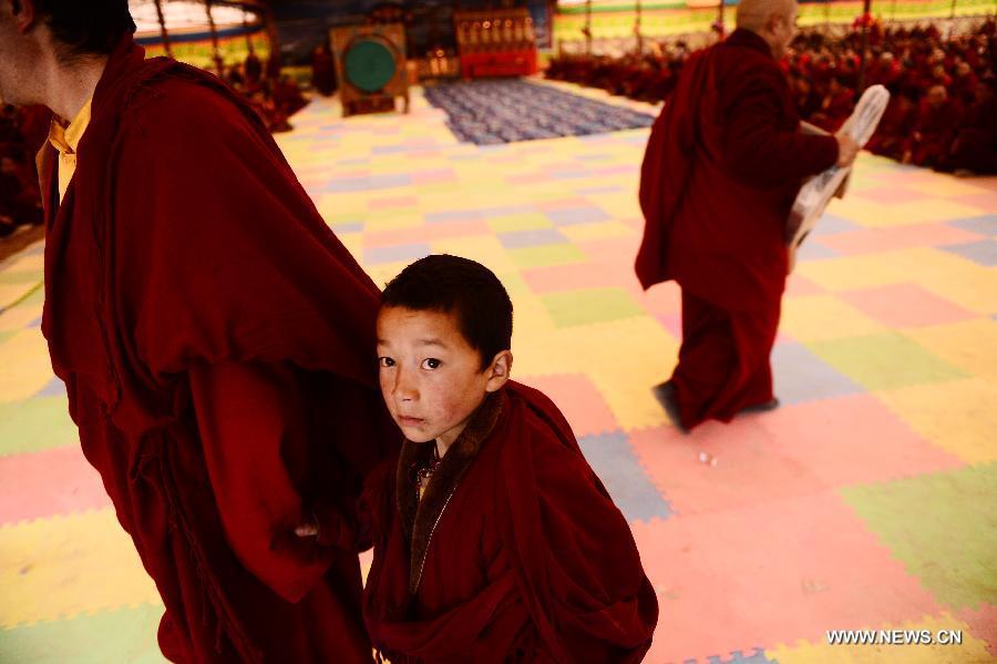 Buddhists takes part in a Buddhist commemoration marking the third anniversary of the Yushu earthquake, in Yushu Tibetan Autonomous Prefecture, northwest China's Qinghai Province, April 14, 2013. A 7.1-magnitude earthquake hit Yushu on April 14, 2010, leaving 2,698 dead and over 12,000 injured. (Xinhua/Zhang Hongxiang)