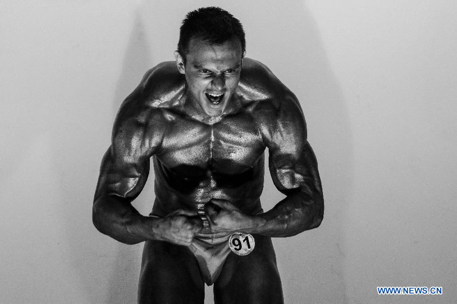 A bodybuilder participates in a bodybuilding competition called "Mr. Colombia" held in Bogota, capital of Colombia, on April 13, 2013. (Xinhua/Jhon Paz)