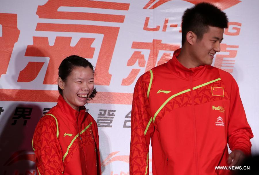 Olympic badminton gold medalist and world No. 1 Li Xuerui (L) and badminton world champion Chen Long of China attend a brand promotion event in Taipei, southeast China's Taiwan, April 15, 2013, ahead of the Badminton Asia Championships which will be held in Taipei arena from April 16 to 21. (Xinhua/Xie Xiudong)