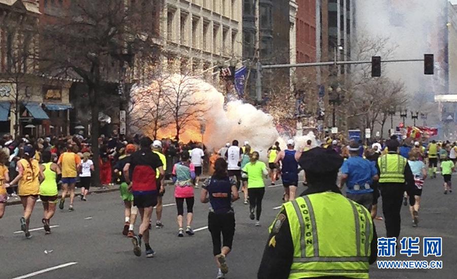 People react following explosions happened in Boston, the United States, April 15, 2013. Three explosions occurred near the Boston Marathon finish line, killing at least 2 people, local media reported. (Xinhua/Zhao Xirong) 