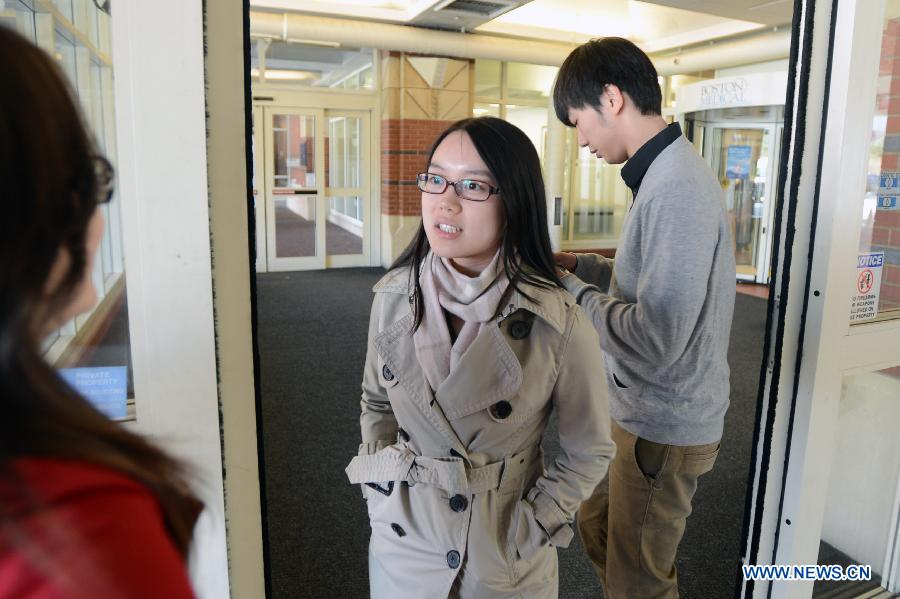 Classmates of injured Chinese student Zhou Danling arrive at the Boston Medical Center in Boston, the United States, April 16, 2013. Zhou, who was injured during the Boston marathon blasts, turned into better condition from critical one after receiving two surgeries. (Xinhua/Wang Lei) 