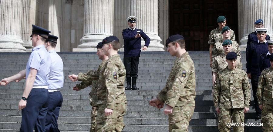 Service men rehearse outside St Paul's Cathedral ahead of the funeral of former Prime Minister Margaret Thatcher in London, April 16, 2013. A ceremonial funeral service for Lady Thatcher will be held at St Paul's Cathedral in London on Wednesday. (Xinhua/Wang Lili) 