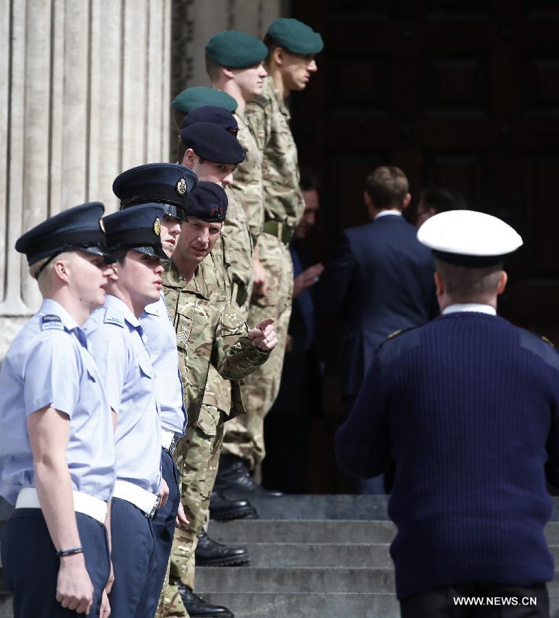 Service men rehearse outside St Paul's Cathedral ahead of the funeral of former Prime Minister Margaret Thatcher in London, April 16, 2013. A ceremonial funeral service for Lady Thatcher will be held at St Paul's Cathedral in London on Wednesday. (Xinhua/Wang Lili) 