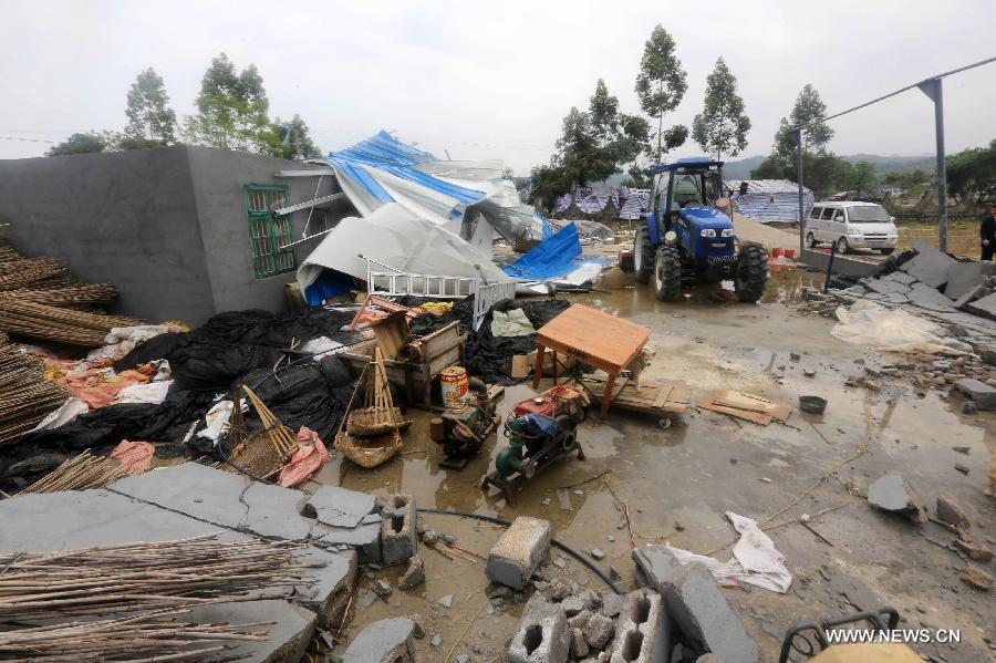 Photo taken on April 17, 2013 shows houses ruined by a tornado in Rongan County, south China's Guangxi Zhuang Autonomous Region. At least six people were injured and dozens of houses destroyed when a tornado swept through parts of Guangxi on Wednesday morning. The storm hit Qixing District, Guilin City and Rongan County, Liuzhou City at around 5 a.m., local meteorological authorities said. Relief work is under way in the affected areas. (Xinhua/Tan Kaixing) 