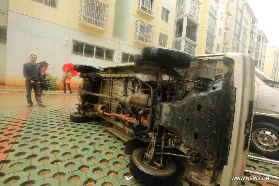 A vehicle lies flipped on one side on the ground after a tornado in Liuzhou, south China's Guangxi Zhuang Autonomous Region, April 17, 2013. At least six people were injured and dozens of houses destroyed when a tornado swept through parts of Guangxi on Wednesday morning. The storm hit Qixing District, Guilin City and Rongan County, Liuzhou City at around 5 a.m., local meteorological authorities said. Relief work is under way in the affected areas. (Xinhua/Tan Kaixing)