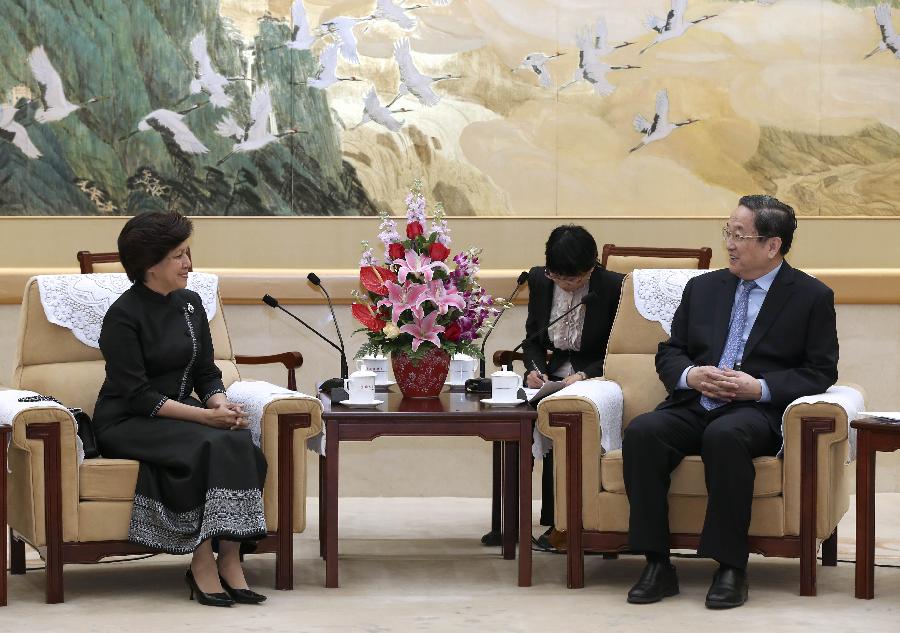 Yu Zhengsheng (R), chairman of the National Committee of the Chinese People's Political Consultative Conference, meets with Norodom Arun Rasmey, president of Cambodian royalist party Funcinpec, in Beijing, capital of China, April 17, 2013. (Xinhua/Pang Xinglei) 