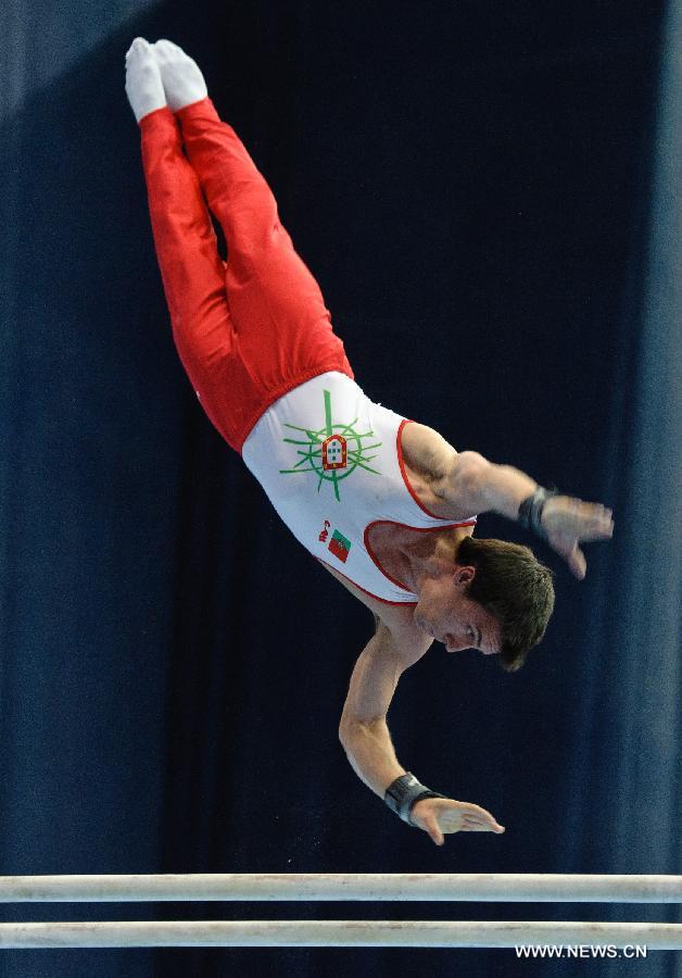 Portugal's Luis competes on the parallel bars during the 5th Men's and Women's Artistic Gymnastics Individual European Championships in Moscow, Russia, April 18, 2013. The event kicked off here on Wednesday. (Xinhua/Jiang Kehong)