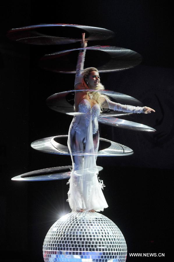 An artist performs during the opening ceremony of the 5th Men's and Women's Artistic Gymnastics Individual European Championships in Moscow, Russia, April 17, 2013. The event kicked off here on Wednesday. (Xinhua/Jiang Kehong)