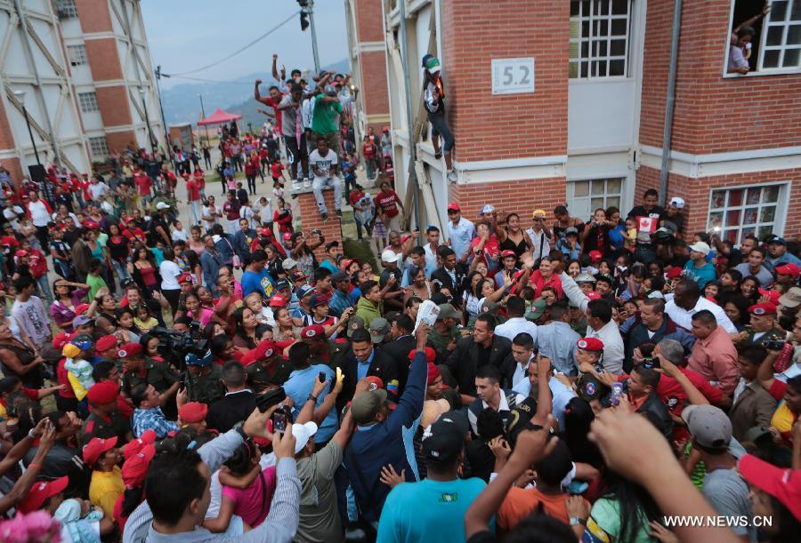 Image provided by the Hugo Chavez Campaign Command shows Venezuelan President-elect Nicolas Maduro taking part in the funeral of a person who died during the clashes after the presidential election, in the municipality of Baruta April 17, 2013. (Xinhua/Hugo Chavez Campaign Command) 