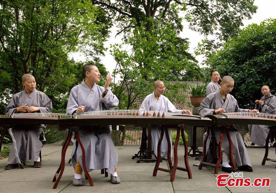 Students play "guzheng," a traditional Chinese musical instrument, at the Buddhist Academy of Emei Mountain in Emei Mountain, Southwest China's Sichuan Province. Established in 1927, the school, covering an area of more than 10,000 square meters presently, has courses mainly on Buddhism studying. (CNS/Liu Zhongjun)