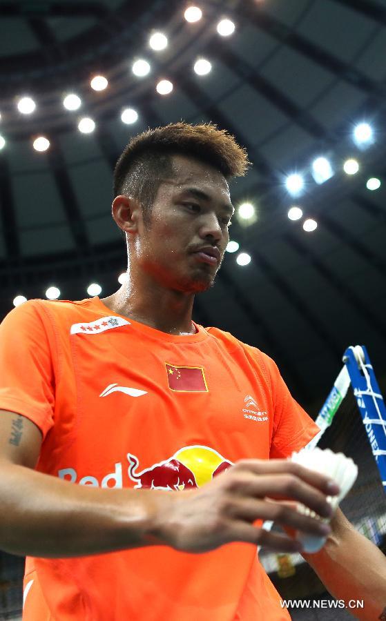 China's Lin Dan reacts during the men's singles third round match against Kazumasa Sakai of Japan at the Badminton Asia Championships in Taipei, southeast China's Taiwan, on April 18, 2013. Lin won 2-1. (Xinhua/Xie Xiudong)