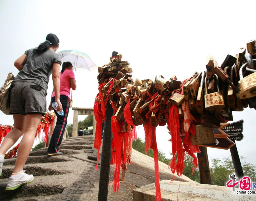 Located in Huayin City, about 120 kilometres east of the city of Xi'an, Mount Hua, one of China's Five Great Mountains, is holy ground for Taoism. It features over 20 Taoist temples, of which the Jade Spring and Zhenyue Palaces are the most famous. It has five peaks, east, west, south, north and central, of which the highest is the South Peak at 2154.9m. Aside from these elements, it is also one of the nine best places to see the sun rise in China. Chaoyang Peak is the best place to watch the sunrise. (China.org.cn)