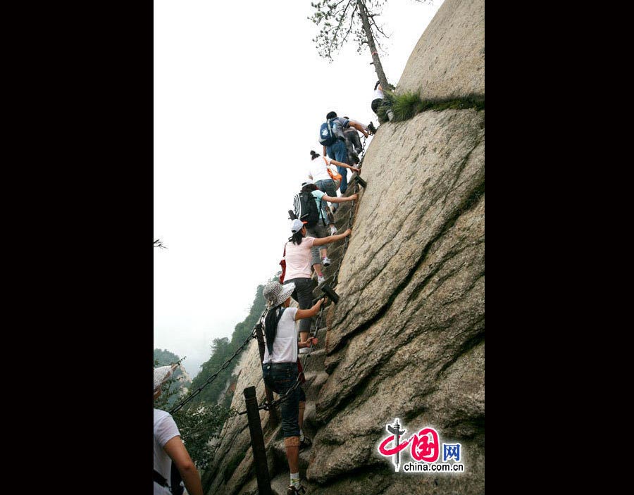 Located in Huayin City, about 120 kilometres east of the city of Xi'an, Mount Hua, one of China's Five Great Mountains, is holy ground for Taoism. It features over 20 Taoist temples, of which the Jade Spring and Zhenyue Palaces are the most famous. It has five peaks, east, west, south, north and central, of which the highest is the South Peak at 2154.9m. Aside from these elements, it is also one of the nine best places to see the sun rise in China. Chaoyang Peak is the best place to watch the sunrise. (China.org.cn)