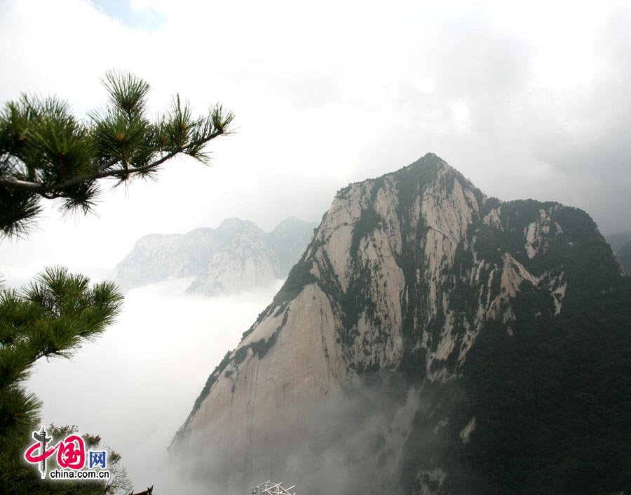 Located in Huayin City, about 120 kilometres east of the city of Xi'an, Mount Hua, one of China's Five Great Mountains, is holy ground for Taoism. It features over 20 Taoist temples, of which the Jade Spring and Zhenyue Palaces are the most famous. It has five peaks, east, west, south, north and central, of which the highest is the South Peak at 2154.9m. Aside from these elements, it is also one of the nine best places to see the sun rise in China. Chaoyang Peak is the best place to watch the sunrise. (China.org.cn)