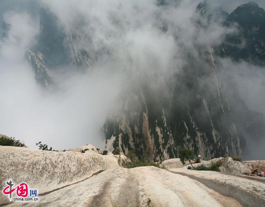 Located in Huayin City, about 120 kilometres east of the city of Xi'an, Mount Hua, one of China's Five Great Mountains, is holy ground for Taoism. It features over 20 Taoist temples, of which the Jade Spring and Zhenyue Palaces are the most famous. It has five peaks, east, west, south, north and central, of which the highest is the South Peak at 2154.9m. Aside from these elements, it is also one of the nine best places to see the sun rise in China. Chaoyang Peak is the best place to watch the sunrise. (China.org.cn)