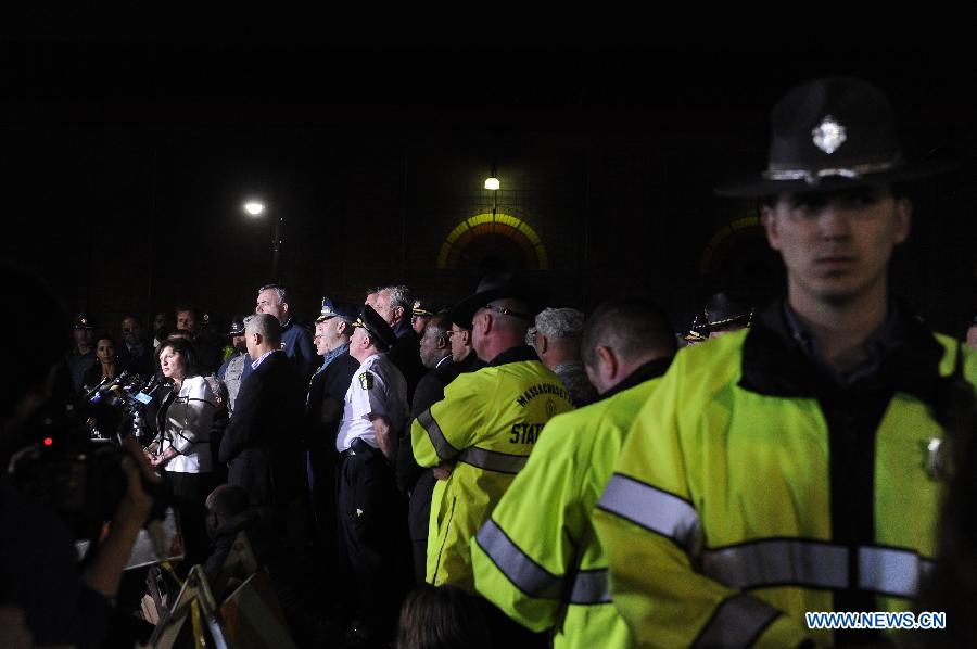 Police hold a press conference about the arrest of a suspect of the Boston bombings in Watertown of Boston, the United States, April 19, 2013. Suspect of the Boston Marathon bombings, 19-year-old Dzhokhar A. Tsarnaev, was captured on a boat parked on a residential property in Watertown, the state of Massachusetts, on Friday. (Xinhua/Zhang Jun) 