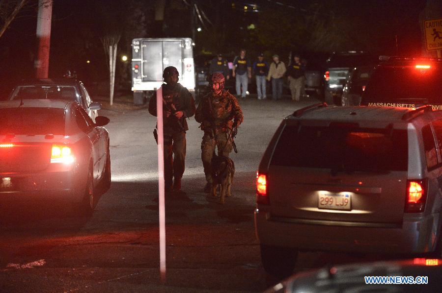 Special policemen leave the place where a suspect of the Boston bombings was arrested in Watertown of Boston, the United States, April 19, 2013. Suspect of the Boston Marathon bombings, 19-year-old Dzhokhar A. Tsarnaev, was captured on a boat parked on a residential property in Watertown, the state of Massachusetts, on Friday. (Xinhua/Zhang Jun) 