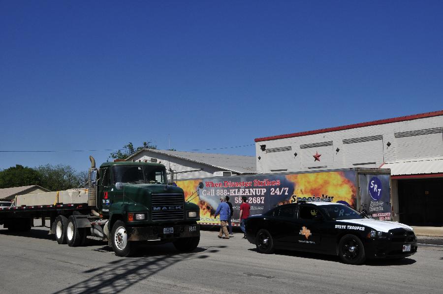 Police vehicle are seen in West, Texas, the United States, April 20, 2013. The Authorities of the city of West, the U.S. state of Texas, on Saturday declared to impose curfew while allowing some of the evacuated residents to return home in the afternoon, more than two days after a powerful explosion at a local fertilizer plant that almost razed the town. (Xinhua/Zhang Yongxing) 