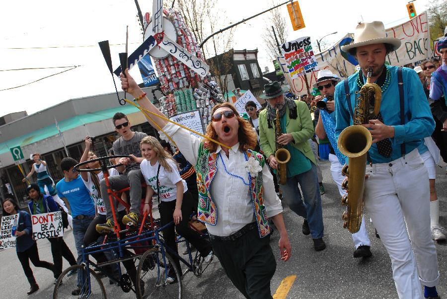 Thousands of people took part in annual Earth Day Parade and march through the streets of Vancouver, Canada, on April 20, 2013. This year's Earth Day Parade is organized by a group of high school students who call themselves "Youth 4 Climate Justice Now" in order to bring government attention to the environmental issues and to do more to leave youth with a sustainable world to inherit. (Xinhua/Sergei Bachlakov) 