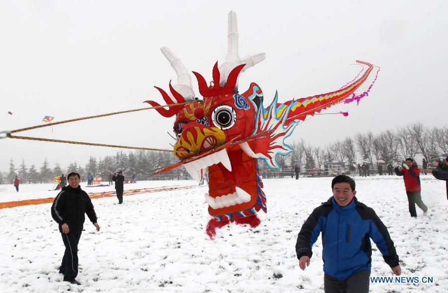 Participants fly kites at the 30th Weifang International Kite Festival in Weifang, east China's Shandong Province, April 20, 2013. Kite-making in Weifang, known as "Kite Capital," can be traced back to the late 16th century and the early 17th century. (Xinhua/Zhang Chi)