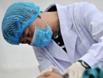 A doctor gives treatment to a wounded people