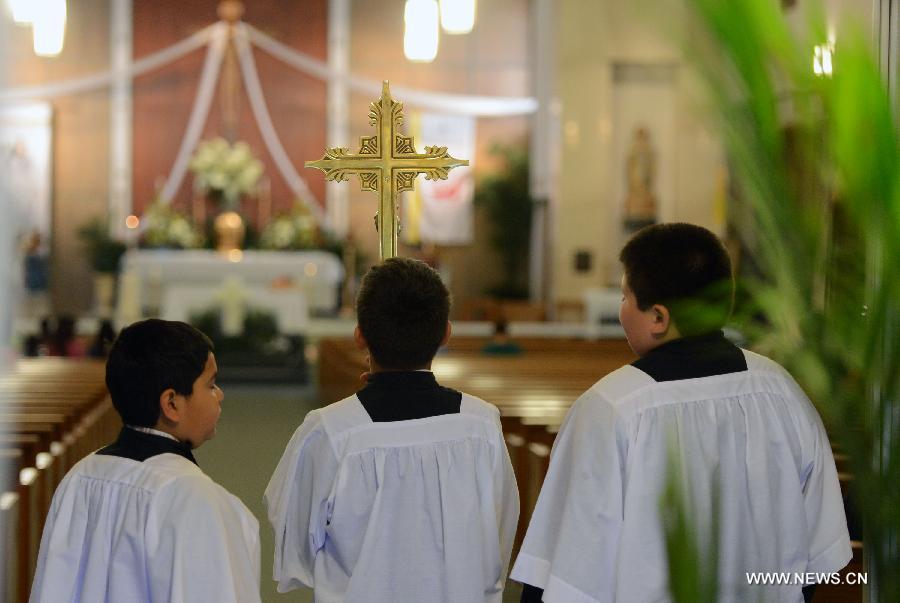 Three kids attend a commemoration ceremony for the deceased people during the furtilizer explosion at a church in West, Texas, April 21, 2013. The powerful blast occurred around 7:50 p.m. local time Wednesday at the fertilizer plant in West, a small town some 320 km north of Houston, Texas, killing at least 14 people and injuring about 200 others. Another 60 remained unaccounted for in the blast, according to local officials. (Xinhua/Wang Lei) 